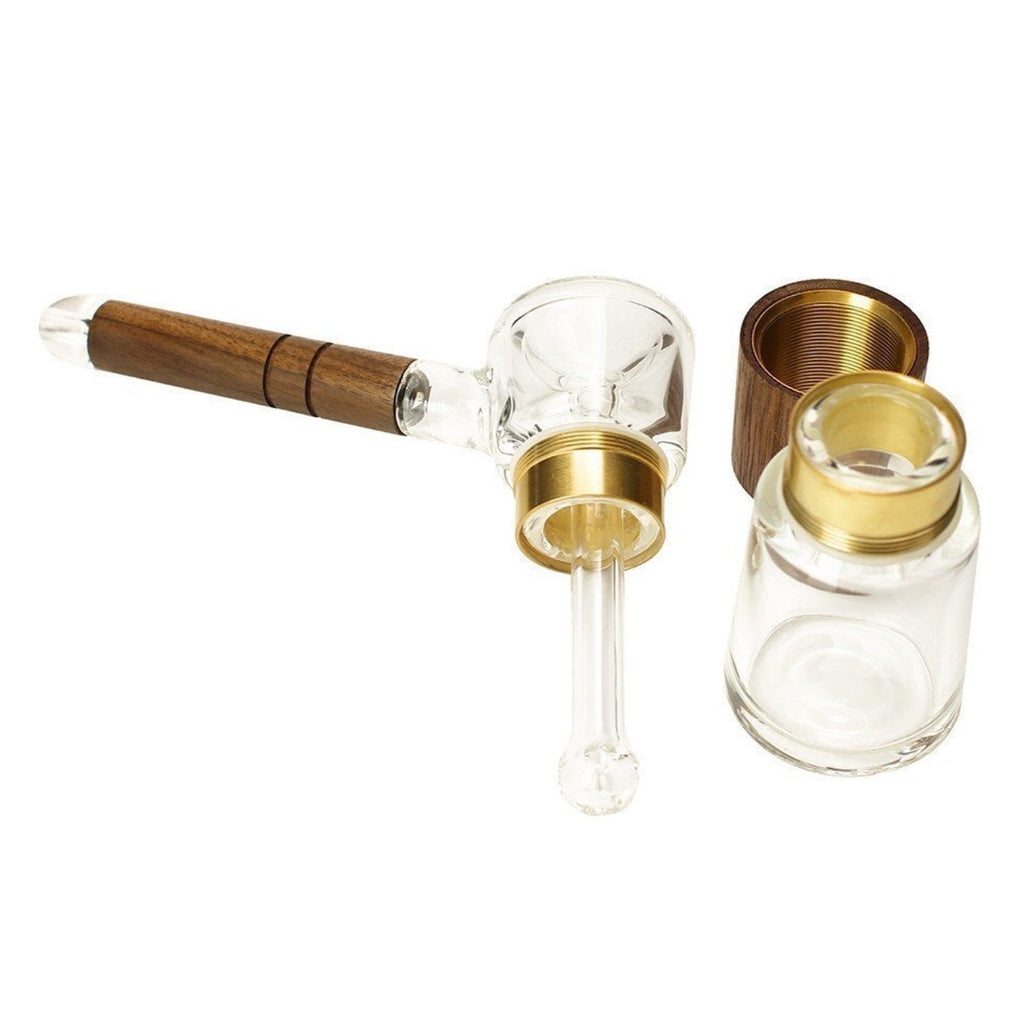 a small glass pipe with a wooden handle